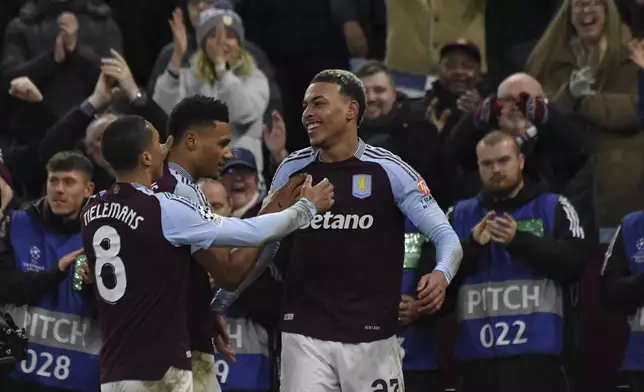 Aston Villa's Morgan Rogers, right, celebrates after scoring his side's fourth goal during the Champions League opening phase soccer match between Aston Villa and Celtic at Villa Park in Birmingham, England, Wednesday, Jan. 29, 2025. (AP Photo/Rui Vieira)