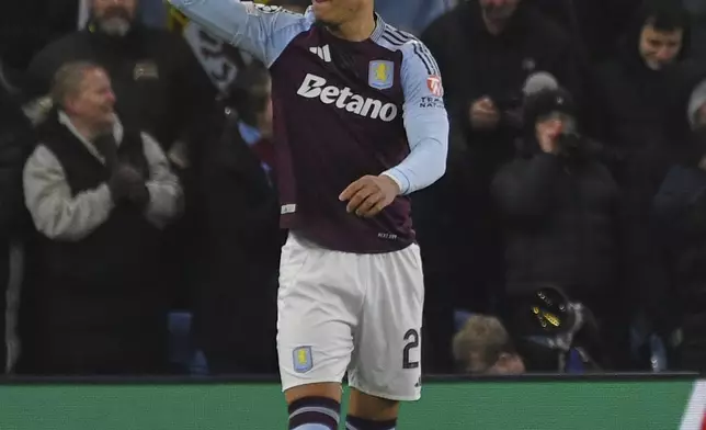 Aston Villa's Morgan Rogers celebrates after scoring the opening goal of his team during the Champions League opening phase soccer match between Aston Villa and Celtic at Villa Park in Birmingham, England, Wednesday, Jan. 29, 2025. (AP Photo/Rui Vieira)