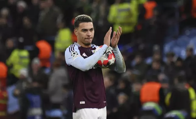 Aston Villa's Morgan Rogers applauds after the Champions League opening phase soccer match between Aston Villa and Celtic at Villa Park in Birmingham, England, Wednesday, Jan. 29, 2025. (AP Photo/Rui Vieira)