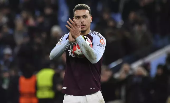 Aston Villa's Morgan Rogers applauds after the Champions League opening phase soccer match between Aston Villa and Celtic at Villa Park in Birmingham, England, Wednesday, Jan. 29, 2025. (AP Photo/Rui Vieira)