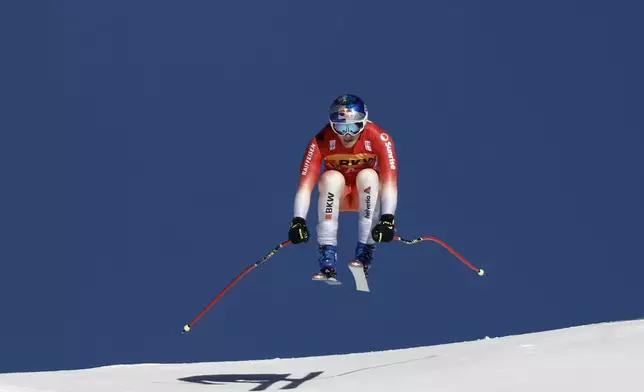 Switzerland's Marco Odermatt speeds down the course during an alpine ski, men's World Cup Super-G, in Wengen, Switzerland, Friday, Jan. 17, 2025. (AP Photo/Gabriele Facciotti)