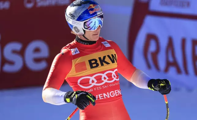 Switzerland's Marco Odermatt gets to the finish area after completing an alpine ski, men's World Cup Super-G, in Wengen, Switzerland, Friday, Jan. 17, 2025 (AP Photo/Giovanni Maria Pizzato)