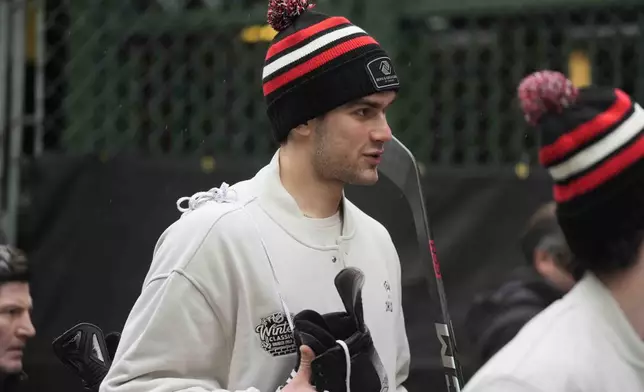 Chicago Blackhawks defenseman Louis Crevier arrives for the NHL Winter Classic outdoor hockey game featuring the Blackhawks and St. Louis Blues at Wrigley Field, Tuesday, Dec. 31, 2024, in Chicago. (AP Photo/Erin Hooley)