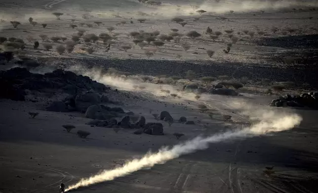 A rider competes during the third stage of the Dakar Rally between Bisha and Al-Henakiyah, Saudi Arabia, Tuesday, Jan. 7, 2025. (AP Photo/Christophe Ena)