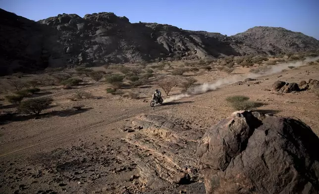 Rider Jerome Martin of Belgium competes during the third stage of the Dakar Rally between Bisha and Al-Henakiyah, Saudi Arabia, Tuesday, Jan. 7, 2025. (AP Photo/Christophe Ena)