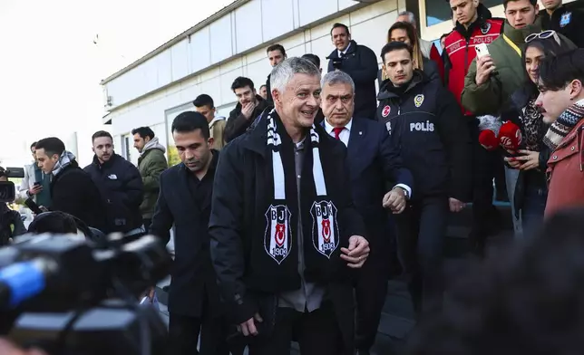 Ole Gunnar Solskjaer wears a Besiktas scarf after being appointed head coach of the Turkish soccer team, outside the Besiktas Sports Club headquarters in Istanbul, Turkey, on Friday, Jan. 17, 2025. (Saycan Sayim/DIA Photo via AP)