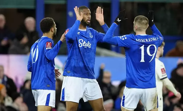 Everton's Beto, center, celebrates scoring during the English FA Cup third round soccer match between Everton and Peterborough United at Goodison Park, Liverpool, England, Thursday Jan. 9, 2025. (Peter Byrne/PA via AP)