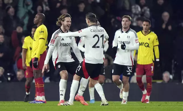 Fulham's Joachim Andersen, second left, celebrates scoring during the English FA Cup third round soccer match between Fulham and Watford at Craven Cottage, London, Thursday Jan. 9, 2025. (Bradley Collyer/PA via AP)