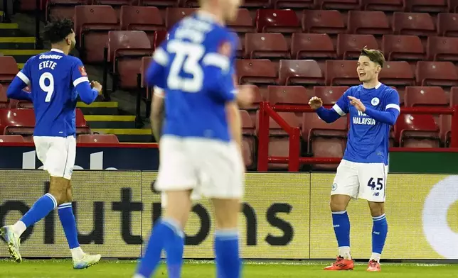 Cardiff City's Cian Ashford, right, celebrates scoring during the English FA Cup third round soccer match between Sheffield United and Cardiff City at Bramall Lane, Sheffield, England, Thursday Jan. 9, 2025. (Danny Lawson/PA via AP)