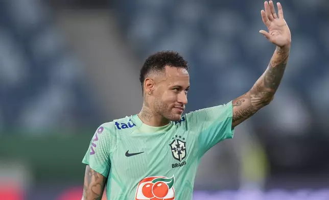 FILE - Brazil's Neymar waves to fans during a training session in Cuiaba, Brazil, Tuesday, Oct. 10, 2023. (AP Photo/Andre Penner, File)