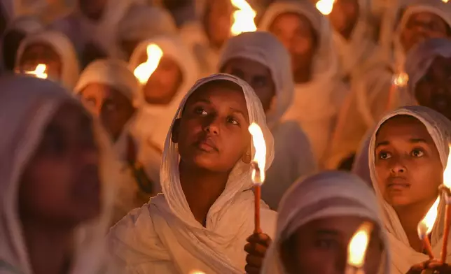 Ethiopian pilgrims pray during a Mass service for Ethiopian Christmas at the Bole Medhane Alem cathedral in Addis Ababa, Ethiopia, Monday, Jan. 6, 2025. (AP Photo)