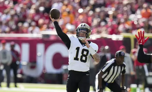 New Orleans Saints quarterback Spencer Rattler (18) passes during the first half of an NFL football game against the Tampa Bay Buccaneers Sunday, Jan. 5, 2025, in Tampa, Fla. (AP Photo/Chris O'Meara)