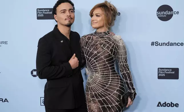 Jennifer Lopez, right, and Tonatiuh, cast members in "Kiss of the Spider Woman," pose together at the premiere of the film during the Sundance Film Festival on Sunday, Jan. 26, 2025, in Park City, Utah. (AP Photo/Chris Pizzello)
