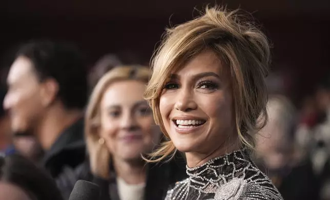 Jennifer Lopez, a cast member in "Kiss of the Spider Woman," looks down the press line at the premiere of the film during the Sundance Film Festival on Sunday, Jan. 26, 2025, in Park City, Utah. (AP Photo/Chris Pizzello)