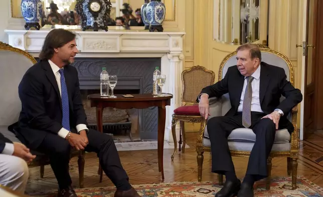 Venezuela's opposition leader Edmundo Gonzalez Urrutia, right, and Uruguayan President Luis Lacalle Pou meet in Montevideo, Uruguay, Saturday, Jan. 4, 2025. Gonzalez, who claims he won the 2024 presidential election and is recognized by some countries as the legitimate president-elect, traveled from exile in Madrid to Argentina and Uruguay. (AP Photo/Matilde Campodonico)