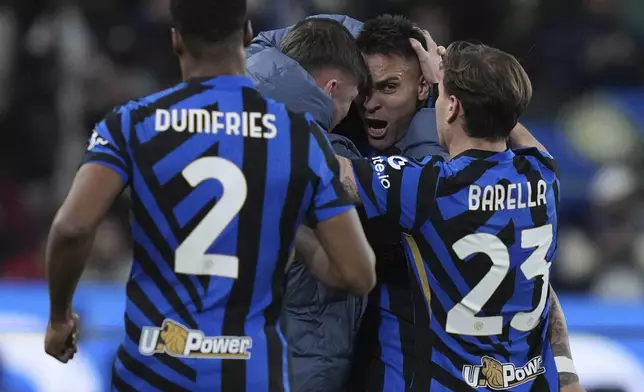 Inter Milan's Lautaro Martinez, second right, celebrates after scoring his side's first goal during the Italian Super Cup final soccer match between AC Milan and Inter Milan at Al Awwal Park Stadium in Riyadh, Saudi Arabia, Monday, Jan. 6, 2025. (Alfredo Falcone/LaPresse via AP)