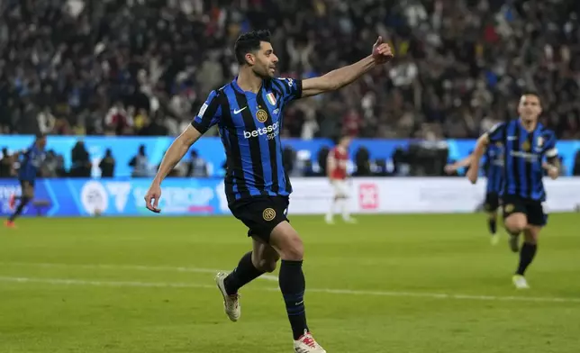 Inter Milan's Mehdi Taremi celebrates after scoring his sides second goal during the Italian Super Cup final soccer match between AC Milan and Inter Milan at Al Awwal Park Stadium in Riyadh, Saudi Arabia, Monday, Jan. 6, 2025. (AP Photo/Altaf Qadri)