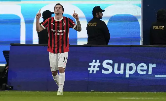 AC Milan's Christian Pulisic celebrates after scoring his sides second goal during the Italian Super Cup final soccer match between AC Milan and Inter Milan at Al Awwal Park Stadium in Riyadh, Saudi Arabia, Monday, Jan. 6, 2025. (AP Photo/Altaf Qadri)