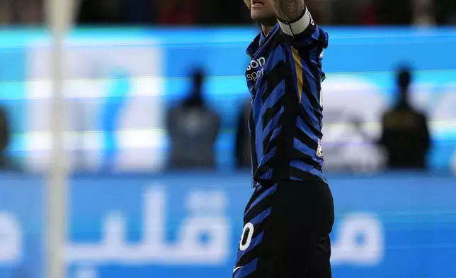 Inter Milan's Lautaro Martinez celebrates after scoring his sides first goal during the Italian Super Cup final soccer match between AC Milan and Inter Milan at Al Awwal Park Stadium in Riyadh, Saudi Arabia, Monday, Jan. 6, 2025. (AP Photo/Altaf Qadri)