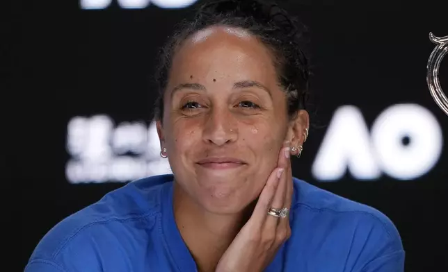 Madison Keys of the U.S. reacts during a press conference after defeating Aryna Sabalenka of Belarus in the women's singles final at the Australian Open tennis championship to win the Daphne Akhurst Memorial Cup, in Melbourne, Australia, Saturday, Jan. 25, 2025. (AP Photo/Vincent Thian)