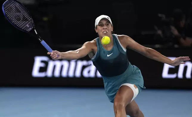 Madison Keys of the U.S. plays a forehand return to Aryna Sabalenka of Belarus during the women's singles final at the Australian Open tennis championship in Melbourne, Australia, Saturday, Jan. 25, 2025. (AP Photo/Ng Han Guan)