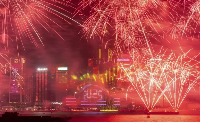 Fireworks explode over Victoria Harbour to celebrate the start of 2025 at Tsim Sha Tsui in Hong Kong, Wednesday, Jan. 1, 2025. (AP Photo/Chan Long Hei)