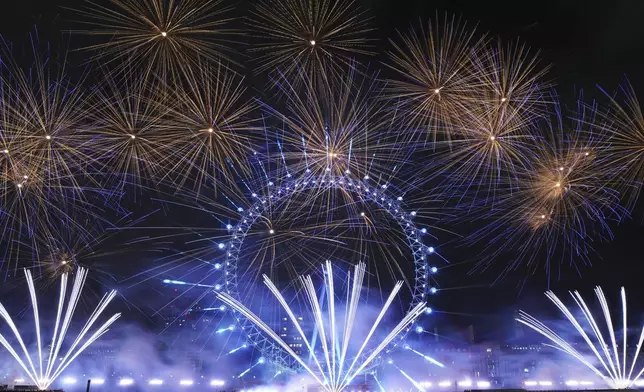 Fireworks light up the sky around the London Eye on the south bank of the River Thames to celebrate the New Year in London, Wednesday, Jan. 1, 2025. (AP Photo/Alberto Pezzali)