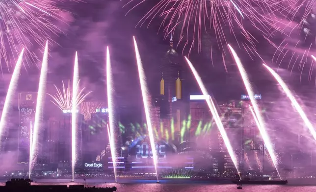 Fireworks explode over Victoria Harbour to celebrate the start of 2025 at Tsim Sha Tsui in Hong Kong, Wednesday, Jan. 1, 2025. (AP Photo/Chan Long Hei)