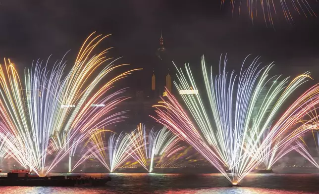 Fireworks explode over Victoria Harbour to celebrate the start of 2025 at Tsim Sha Tsui in Hong Kong, Wednesday, Jan. 1, 2025. (AP Photo/Chan Long Hei)