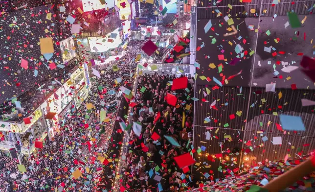 Confetti is thrown over Times Square during the annual New Year's Eve celebration, Wednesday, Jan. 1, 2025, in New York. (AP Photo/Heather Khalifa)