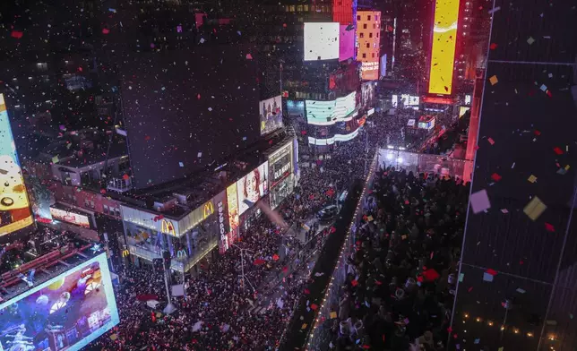 A view of Times Square as confetti falls during the annual New Year's Eve celebration, Wednesday, Jan. 1, 2025, in New York. (AP Photo/Heather Khalifa)