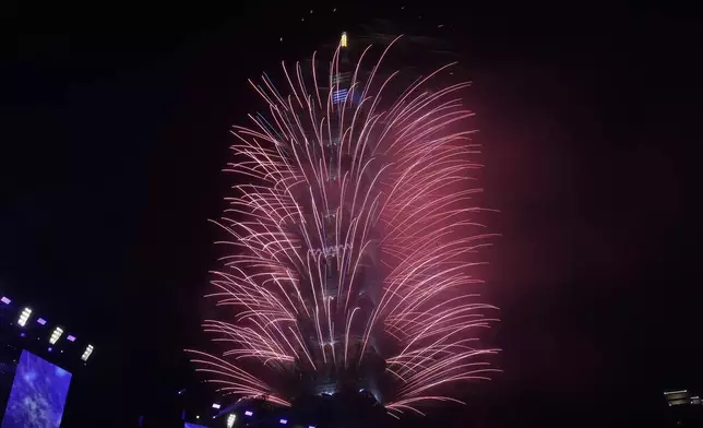 Fireworks explode from the Taipei 101 building during the New Year's celebrations in Taipei, Taiwan, Wednesday, Jan. 1, 2025. (AP Photo/Chiang Ying-ying)