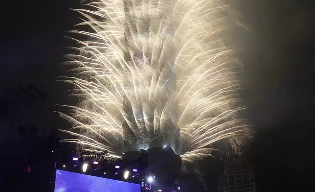 Fireworks explode from the Taipei 101 building during the New Year's celebrations in Taipei, Taiwan, Wednesday, Jan. 1, 2025. (AP Photo/Chiang Ying-ying)