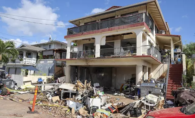 A view of the home where a New Year's Eve fireworks explosion killed and injured people, Wednesday, Jan. 1, 2025, in Honolulu. (AP Photo/Marco Garcia)