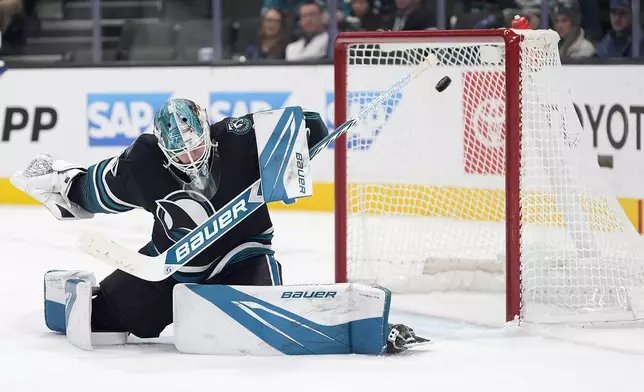 San Jose Sharks goaltender Yaroslav Askarov allows a goal by Tampa Bay Lightning center Anthony Cirelli during the second period of an NHL hockey game in San Jose, Calif., Thursday, Jan. 2, 2025. (AP Photo/Tony Avelar)