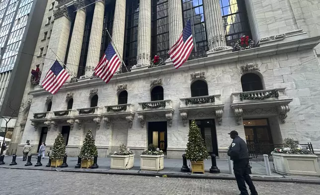 FILE - The New York Stock Exchange is shown in New York's Financial District on Dec. 31, 2024. American flags flew at half-staff there following the death of former U.S. president Jimmy Carter. (AP Photo/Peter Morgan, File)