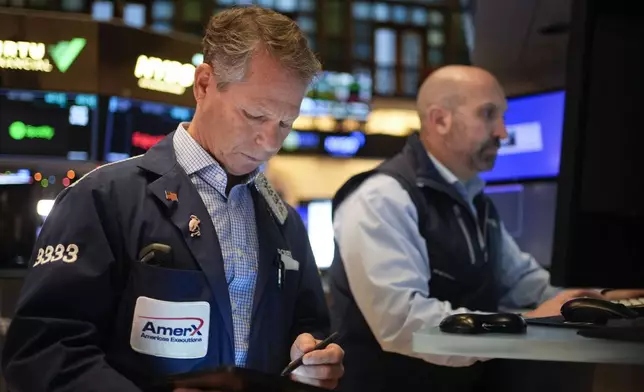 Traders work on the floor at the New York Stock Exchange in New York's Financial District Thursday, Jan. 2, 2025. (AP Photo/Seth Wenig)