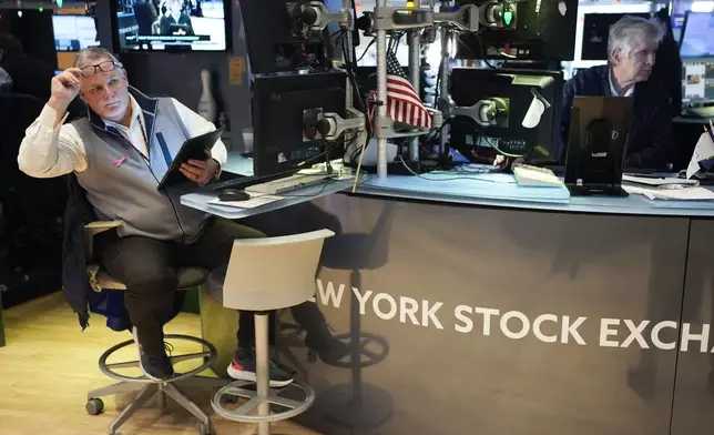 Traders work on the floor at the New York Stock Exchange in New York's Financial District Thursday, Jan. 2, 2025. (AP Photo/Seth Wenig)