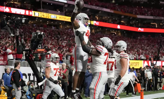 Ohio State wide receiver Jeremiah Smith celebrates after scoring against Notre Dame during first half of the College Football Playoff national championship game Monday, Jan. 20, 2025, in Atlanta. (AP Photo/Brynn Anderson)