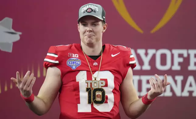 Ohio State quarterback Will Howard celebrates after the Cotton Bowl College Football Playoff semifinal game against Texas, Friday, Jan. 10, 2025, in Arlington, Texas. (AP Photo/Julio Cortez)