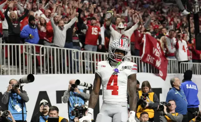 Ohio State wide receiver Jeremiah Smith celebrates after scoring against Notre Dame during first half of the College Football Playoff national championship game Monday, Jan. 20, 2025, in Atlanta. (AP Photo/Brynn Anderson)