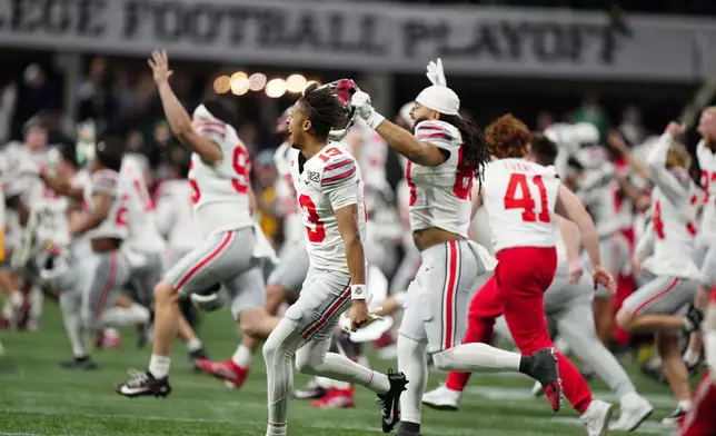 Ohio State celebrates after their win against Notre Dame in the College Football Playoff national championship game Monday, Jan. 20, 2025, in Atlanta. (AP Photo/Jacob Kupferman)