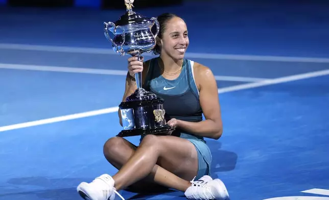 Madison Keys of the U.S. holds the Daphne Akhurst Memorial Cup after defeating Aryna Sabalenka of Belarus in the women's singles final at the Australian Open tennis championship in Melbourne, Australia, Saturday, Jan. 25, 2025. (AP Photo/Ng Han Guan)
