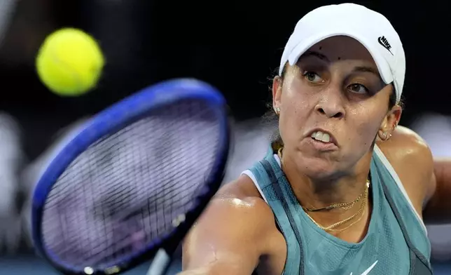 Madison Keys of the U.S. plays a backhand return to Aryna Sabalenka of Belarus during the women's singles final at the Australian Open tennis championship in Melbourne, Australia, Saturday, Jan. 25, 2025. (AP Photo/Asanka Brendon Ratnayake)