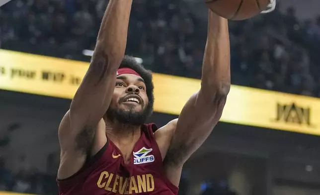 Cleveland Cavaliers center Jarrett Allen dunks on the Dallas Mavericks during the first half of an NBA basketball game, Friday, Jan. 3, 2025, in Dallas. (AP Photo/Julio Cortez)