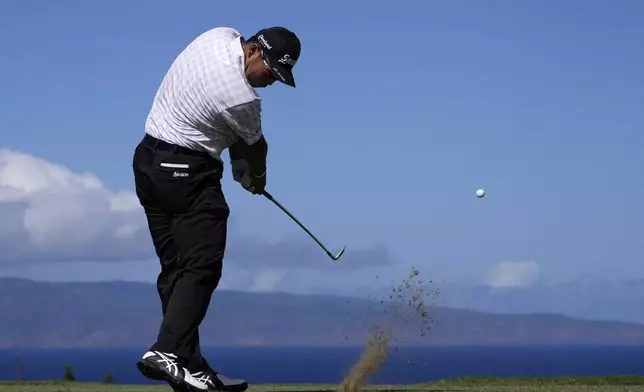 Hideki Matsuyama, of Japan, hits a shot at the 11th hole during the second round of The Sentry golf event, Friday, Jan. 3, 2025, at the Kapalua Plantation Course in Kapalua, Hawaii. (AP Photo/Matt York)