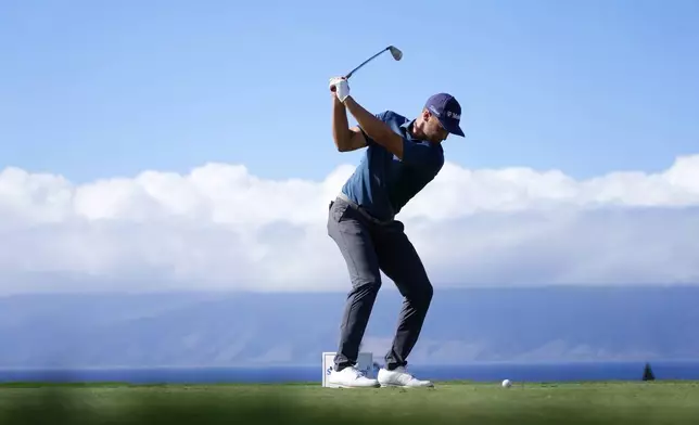 Wyndham Clark hits his tee shot at the 11th hole during the second round of The Sentry golf event, Friday, Jan. 3, 2025, at the Kapalua Plantation Course in Kapalua, Hawaii. (AP Photo/Matt York)