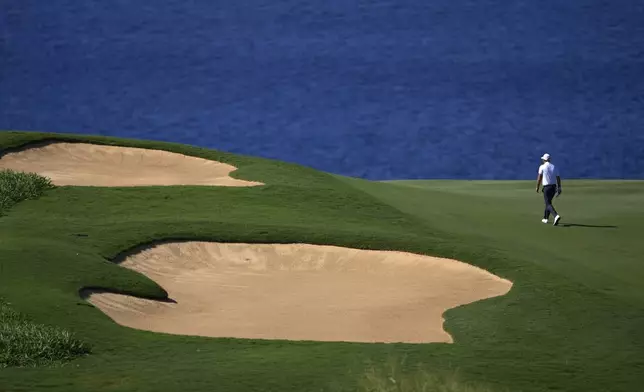 Tom Hoge walks up the 12th fairway during the second round of The Sentry golf event, Friday, Jan. 3, 2025, at the Kapalua Plantation Course in Kapalua, Hawaii. (AP Photo/Matt York)