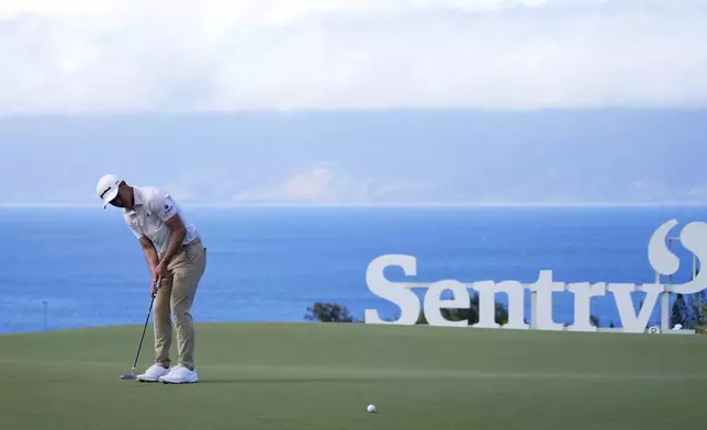 Collin Morikawa watches his birdie putt at the 10th hole during the second round of The Sentry golf event, Friday, Jan. 3, 2025, at the Kapalua Plantation Course in Kapalua, Hawaii. (AP Photo/Matt York)