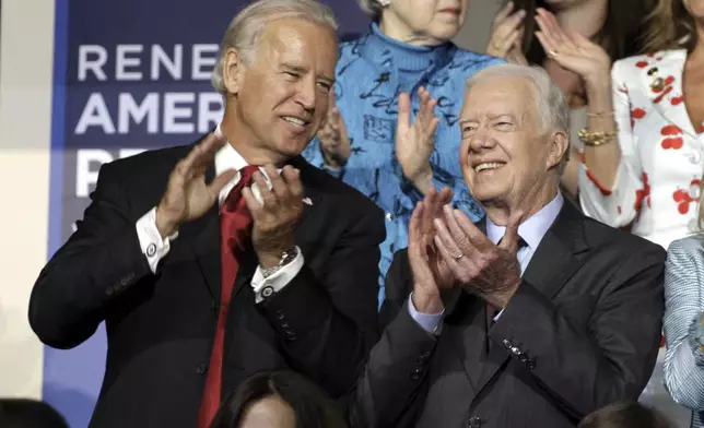 FILE - Former President Jimmy Carter and Sen. Joe Biden, D-Del., at the Democratic National Convention in Denver, Aug. 26, 2008. (AP Photo/Paul Sancya, File)